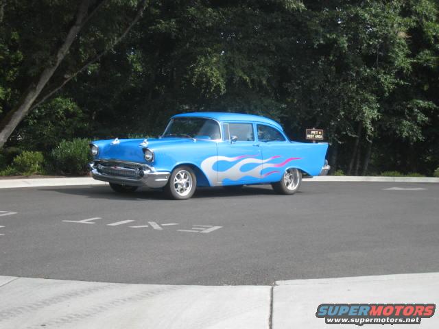 Blue 1957 Chevrolet Bel Air with pink and silver flames
