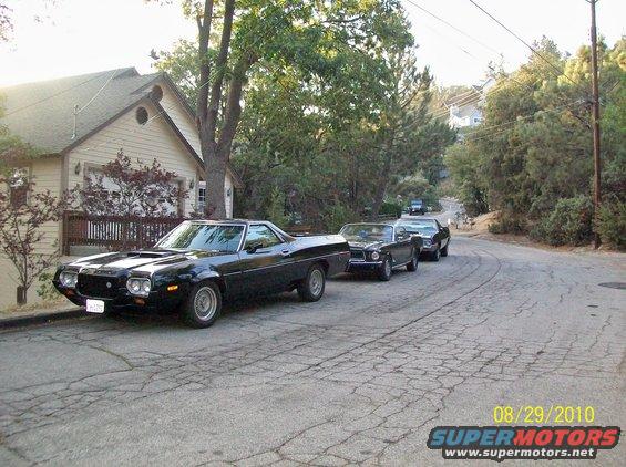 1972 Ford Ranchero parked on street with two other cars behind it