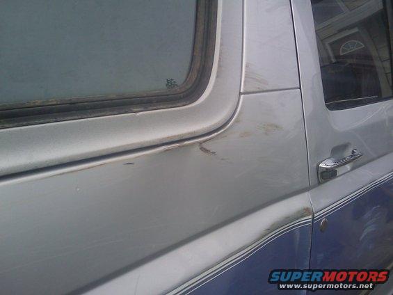 1996 Ford Bronco side panel with two-tone paint and chrome door handle