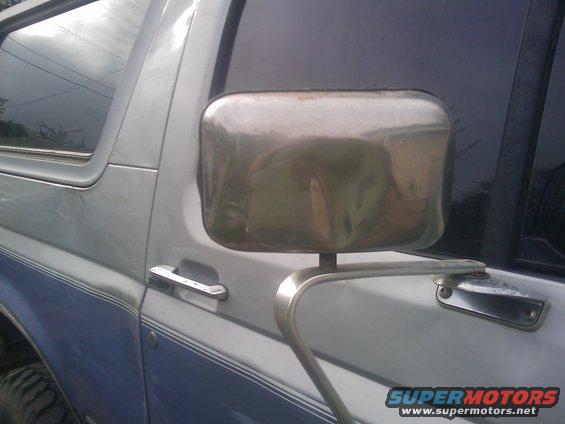 1996 Ford Bronco side view with chrome mirror