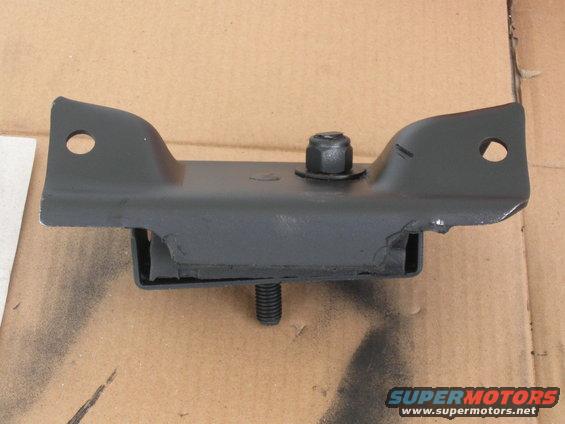 black metal engine mount with rubber isolator and bolts, on cardboard