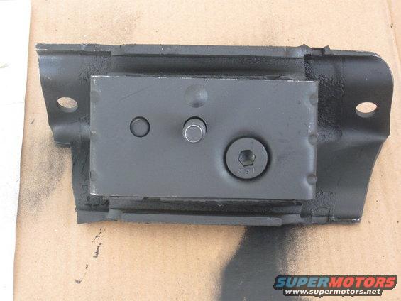 Black metal motor mount with rubber isolator, showing a hex bolt and two smaller pins