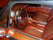 1995 Mercury Grand Marquis - The interior of this classic car features a wood-rimmed steering wheel and distinctive orange upholstery.