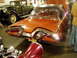 1995 Mercury Grand Marquis - The distinctive tail fins and dual exhaust ports of a 1958 Plymouth Fury are visible in this indoor shot.