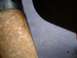 1995 Ford Bronco - Close-up of a corroded metal component, possibly from a vehicle's steering system.