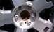 2009 Ford F-150 - Wheel hub detail showing lug nuts and center cap.