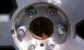 2009 Ford F-150 - The wheel hub shows six lug nuts and a rusty center cap, with a watermark for Supermotors.net.