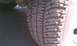 2009 Ford F-150 - A close-up view of a vehicle's tire tread, showing wear patterns and texture.