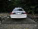 2001 Audi A4 - Model police car with 'POLICE' text on the trunk, set against a backdrop of trees and rocks.