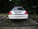2001 Audi A4 - A police car is parked outdoors, with trees and rocks in the background.