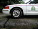 2001 Audi A4 - A white police car, possibly a model, is shown from the front quarter with "POLICE" and RCMP markings visible.