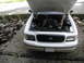 2001 Audi A4 - This 2001 Ford Crown Victoria is shown from the front with its hood open, revealing the engine compartment. The grille design is characteri…