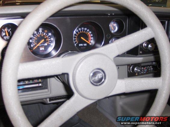 Dashboard of a 1979 Chevrolet Camaro with gauges and steering wheel