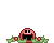 Pixelated pink character on green background