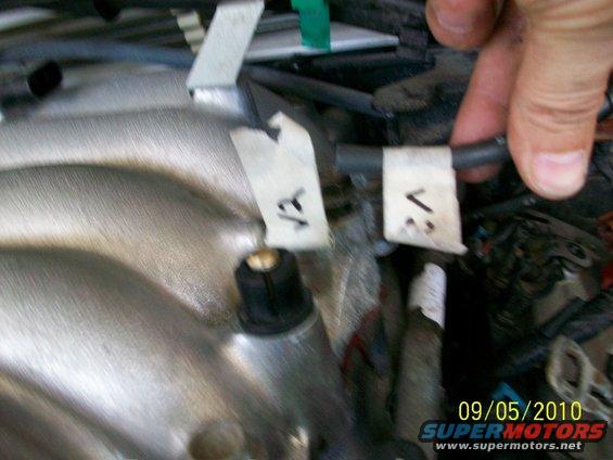 Engine part with wires labeled V1 and V2