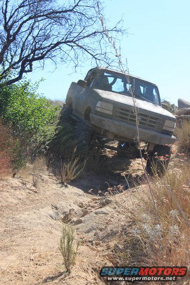 Tan SUV climbing a dirt hill, 1992 Ford Bronco