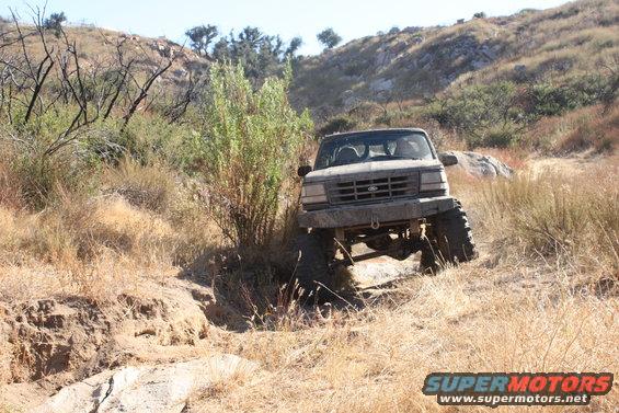 1992 Ford Bronco navigating a rocky trail