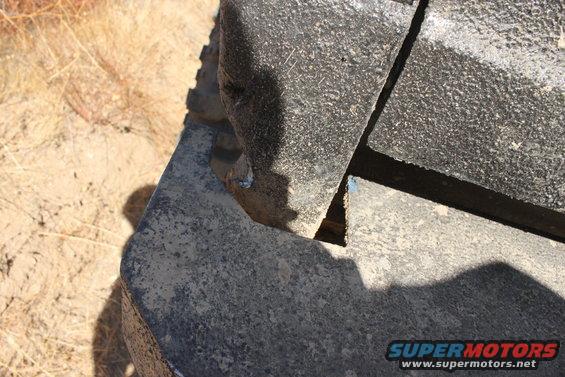 Gray textured bumper fragment with a shadow cast on it