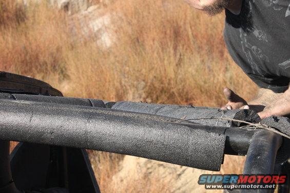 Roll bar padding on a vehicle with Supermotors.net logo