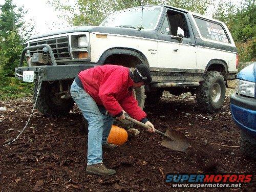 35.jpg First get your friends and head to the mountains.  Then draw a face on the pumpkin and dig a small hole to support the squash...