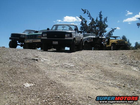 1989 Ford Bronco front view with other off-road vehicles