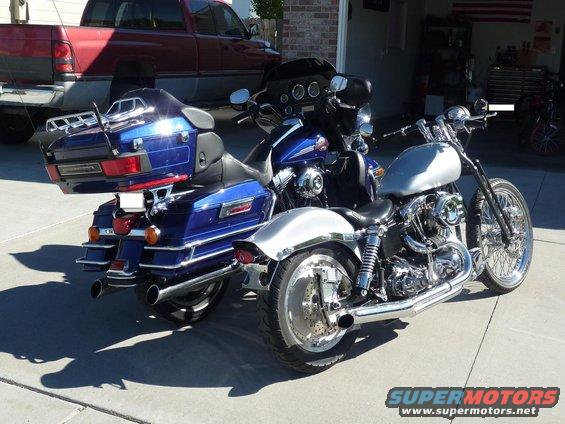 Blue Harley-Davidson Electra Glide Clsc rear view, parked next to a silver motorcycle