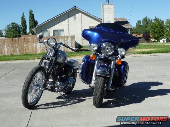 2007 Harley-Davidson Electra Glide Clsc and a custom bobber motorcycle parked on a driveway