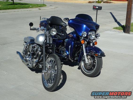 Blue and silver Harley-Davidson motorcycles parked side-by-side