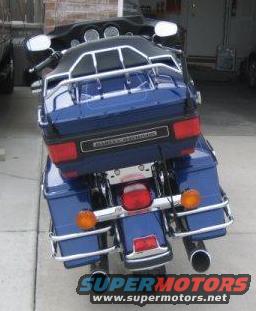 Blue Harley-Davidson motorcycle with saddlebags and a trunk
