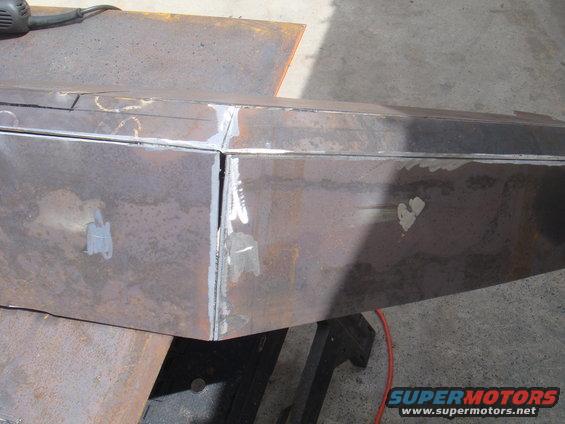 Welding seams on a custom metal bumper being fabricated