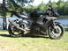 2008 Yamaha R1 - A black Yamaha R6 motorcycle is parked on a grassy area next to a body of water.