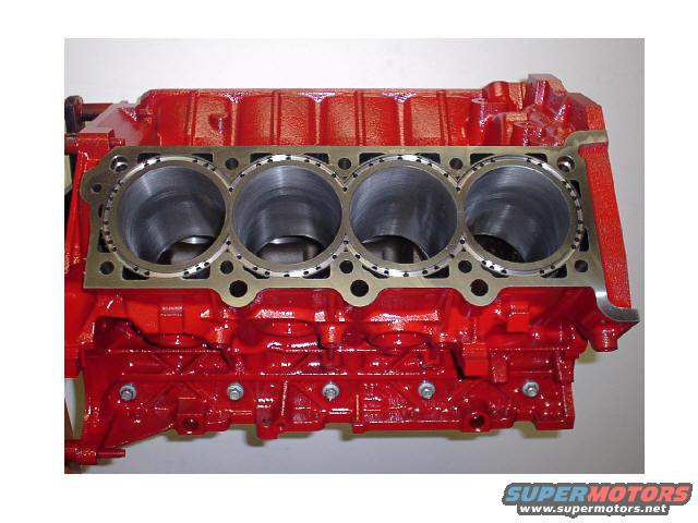red engine block with four cylinders visible
