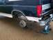 1992 Ford Bronco - A 1992 Ford Bronco is shown with its rear wheel removed and supported by a jack.