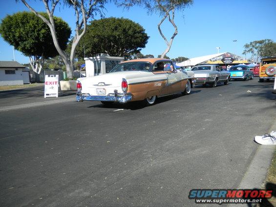 Two-tone brown and white 1955 Mercury sedan, rear view, chrome bumper, whitewall tires