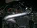 1995 Ford Probe - Close-up view of a modified engine bay a turbocharger and intake system.