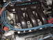 1995 Ford Probe - Close-up of a black engine intake manifold "TURBO GT" text.