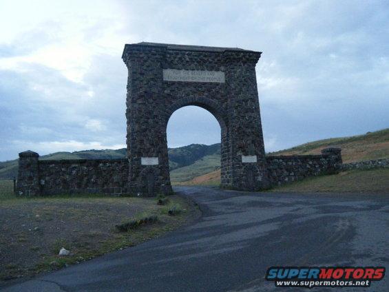 Stone archway entrance with text reading 'For the benefit and enjoyment of the people'