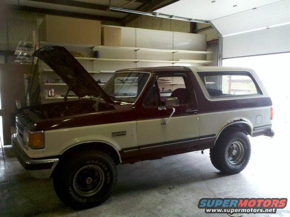 Two-tone maroon and white 1990 Ford Bronco with hood open