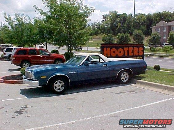 Blue 1975 Ford Ranchero pickup truck, side view, parked in a lot