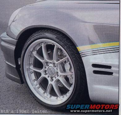 Close-up of a silver BBS wheel on a car fender with yellow and black stripes