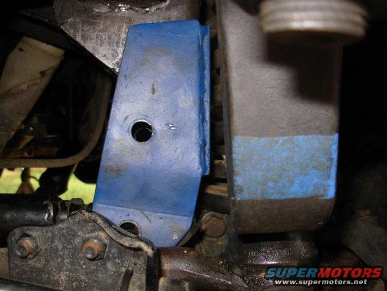 23aligned.jpg It's obvously flat against the frame, but it's equally obvious that the holes aren't drilled straight down from the original location, so the track bar needs to be shortened.  But this adjustable track bar is already as short as it can get.