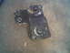 1986 Ford Bronco - This is a metal bracket with bolts, likely a vehicle part, but not a 1986 Ford Bronco.
