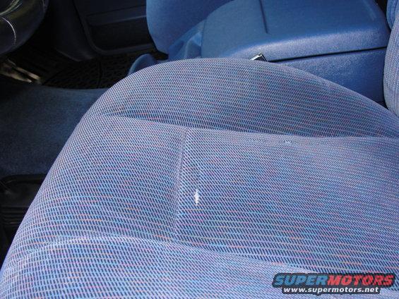 Blue patterned fabric seat and center console in a car interior