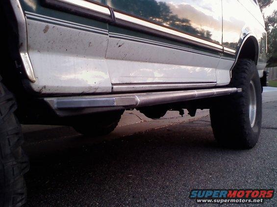 Side view of 1996 Ford Bronco with aftermarket sliders and large tires