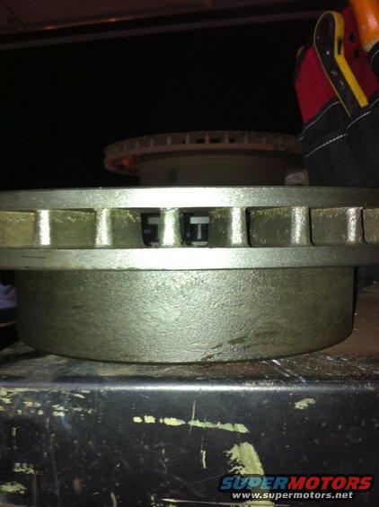 Close-up of a vented brake rotor with a second rotor visible behind it