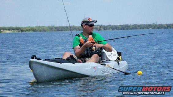 Man fishing from a kayak on a lake
