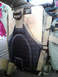 1984 Ford Bronco - A tan backpack with a clipboard secured to its front, showing a partial drawing.