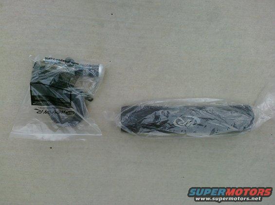 Two automotive parts in plastic packaging, one with a logo