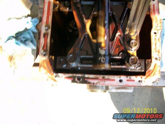 Engine oil pan with internal components and a date stamp of 09/12/2010