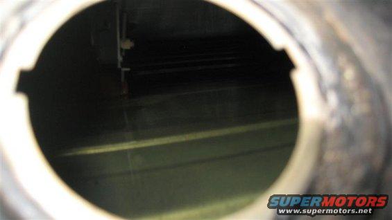 View inside a fuel tank with some liquid at the bottom